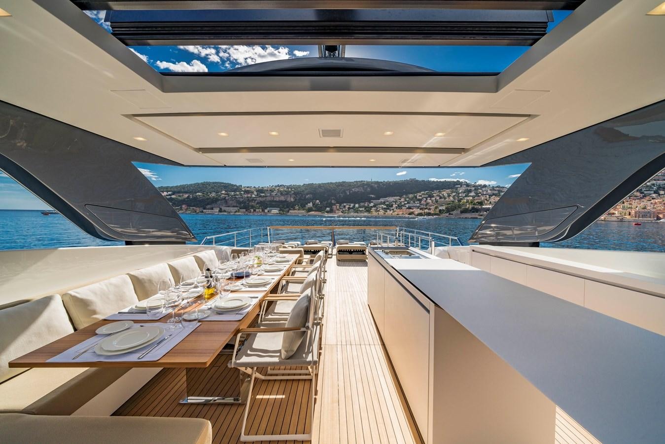a deck with a view of a city and water aboard SALT Yacht for Charter